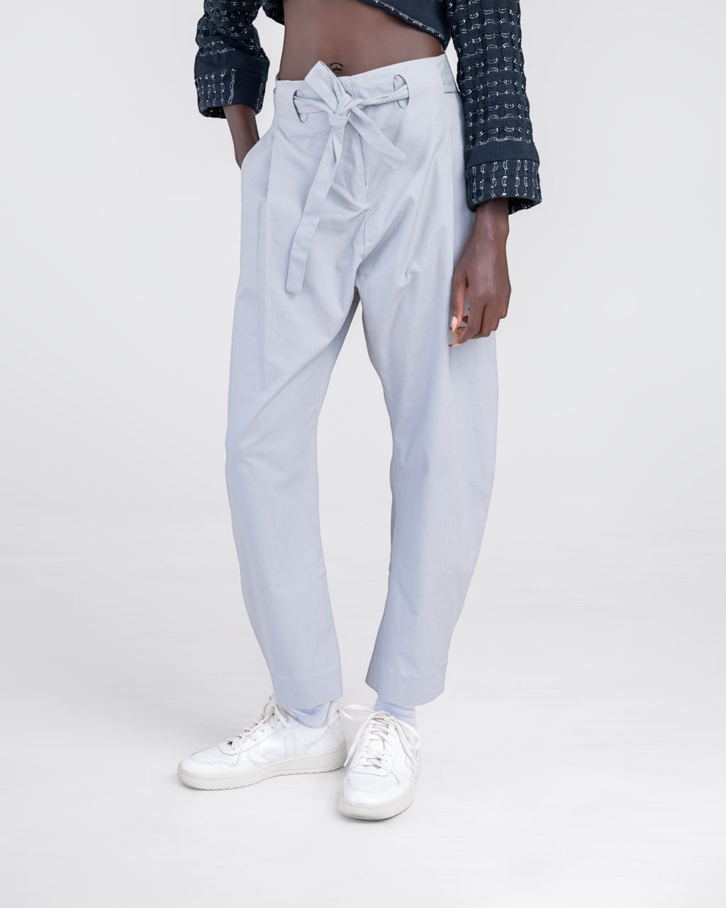 NAMLAB light grey barrel-legged trousers with a cutout waist and tie detail.