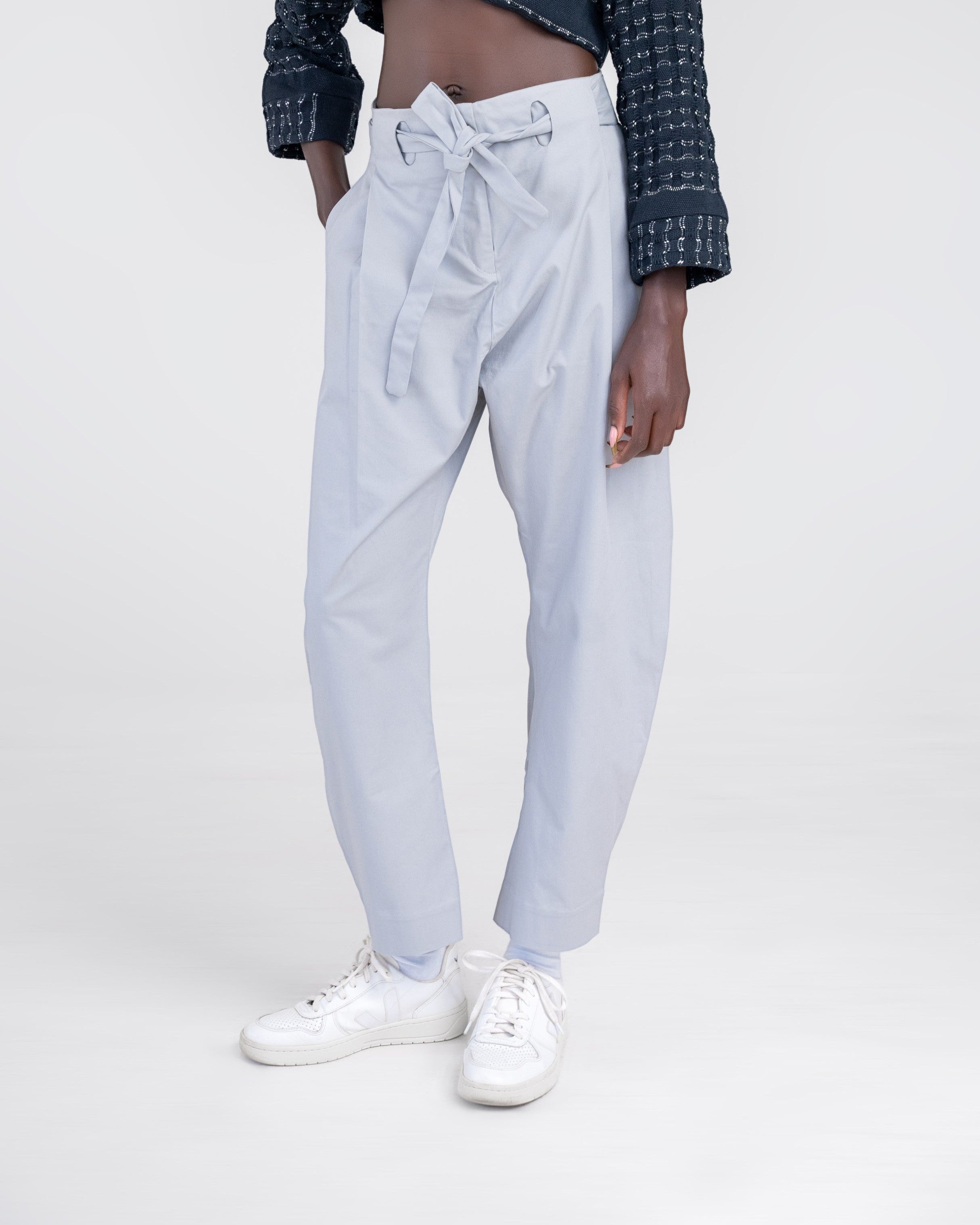 NAMLAB light grey barrel-legged trousers with a cutout waist and tie detail.